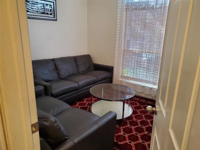 a view of an entryway with wooden floor