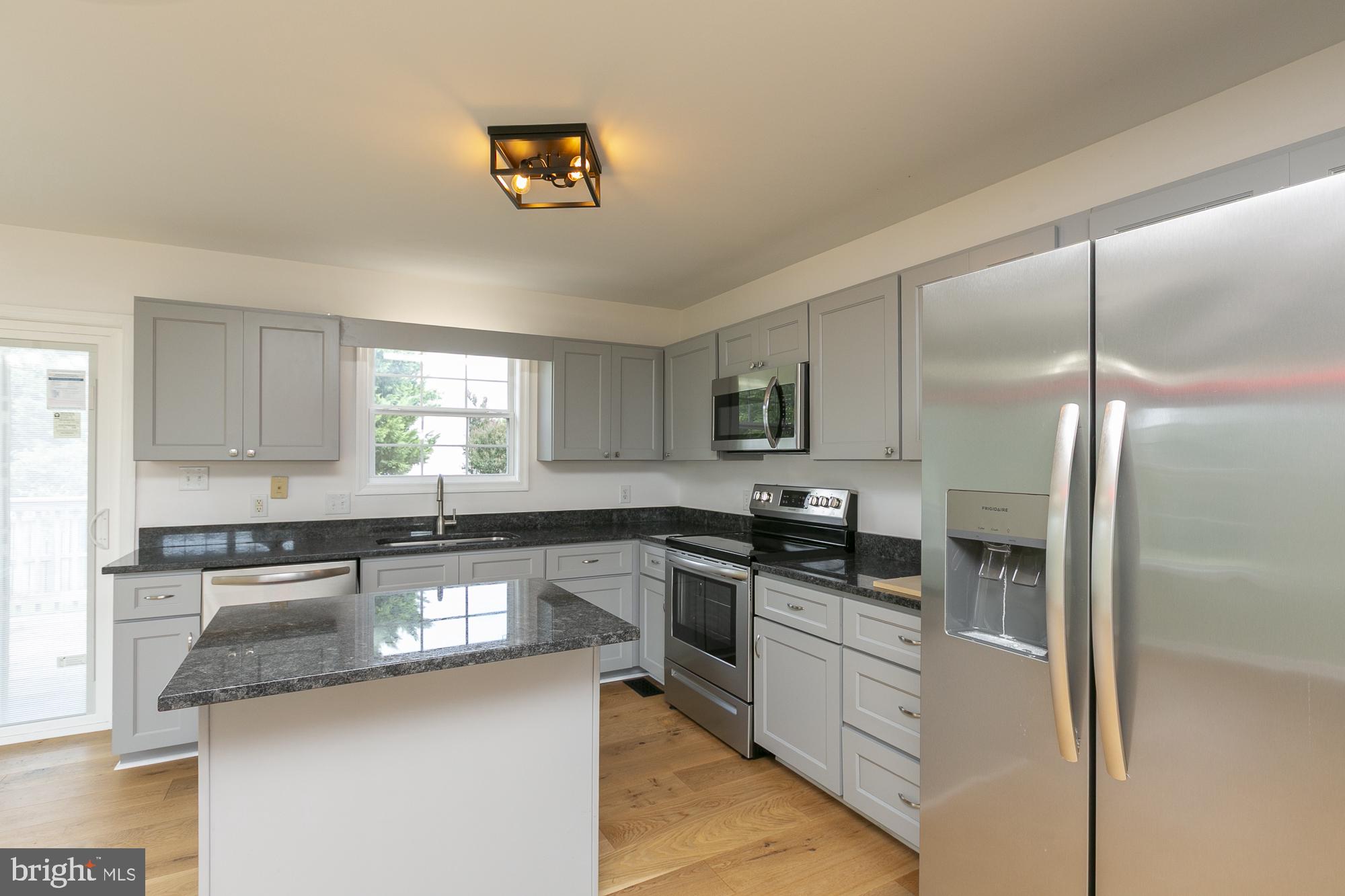 28 Roger Court Ranson, WV 25438 - Photo 8 of 33 Modern kitchen with sleek finishes.
