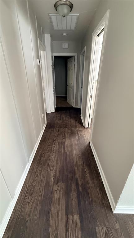 1309 Anna Street Denton, TX 76201 - Photo 13 of 13 Corridor featuring dark wood-type flooring and baseboards