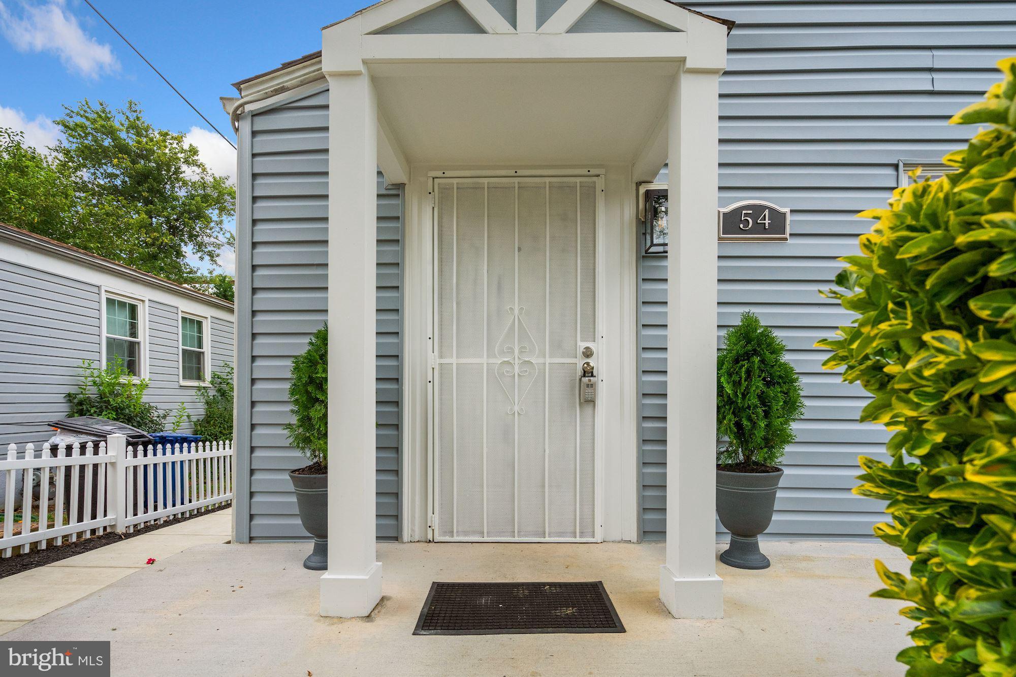 54 East Reed Avenue Alexandria, VA 22305 - Photo 4 of 26 All new siding and sidewalks. Shows New!!
