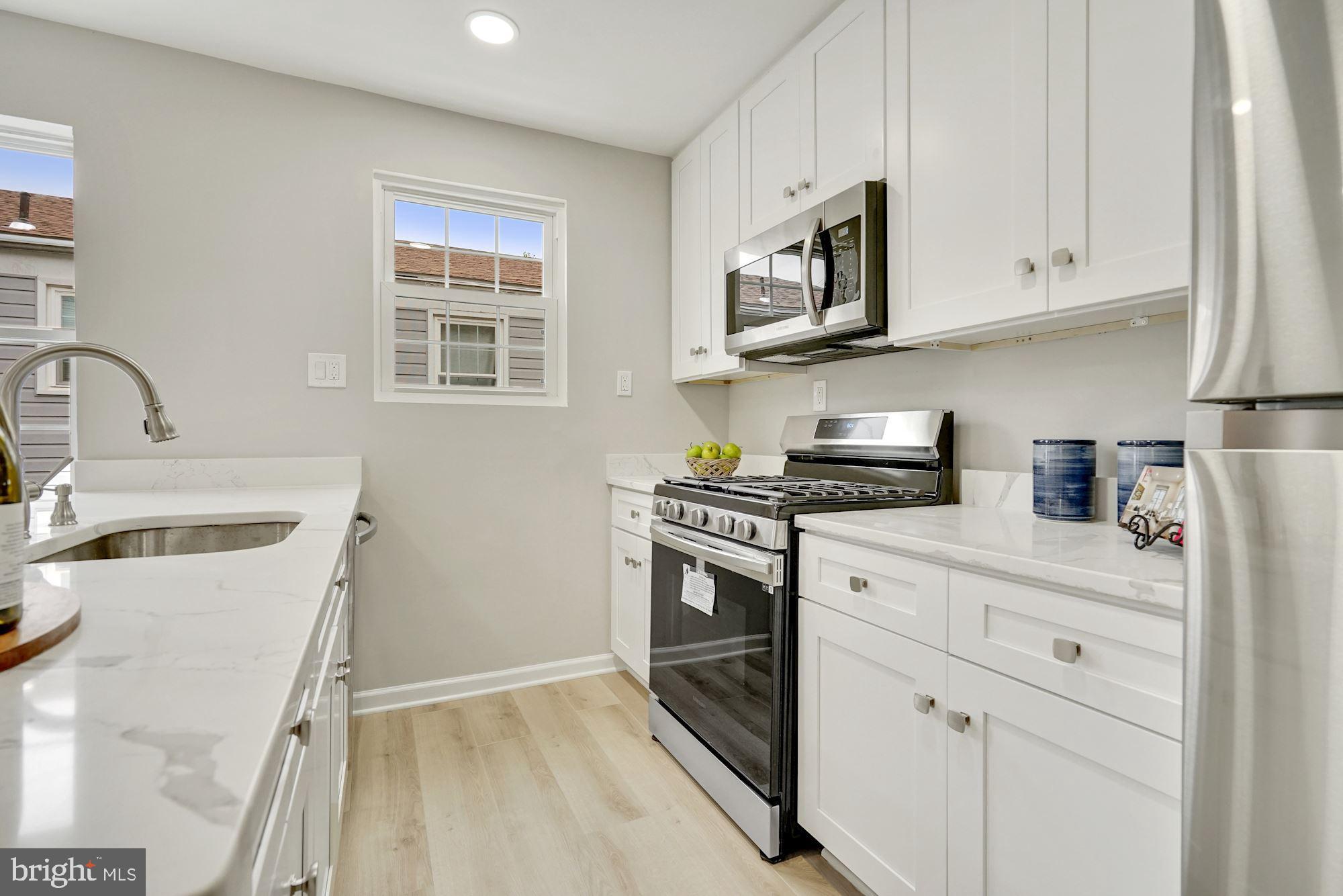 54 East Reed Avenue Alexandria, VA 22305 - Photo 6 of 26 Quartz counter, stainless appl's, white cabinets
