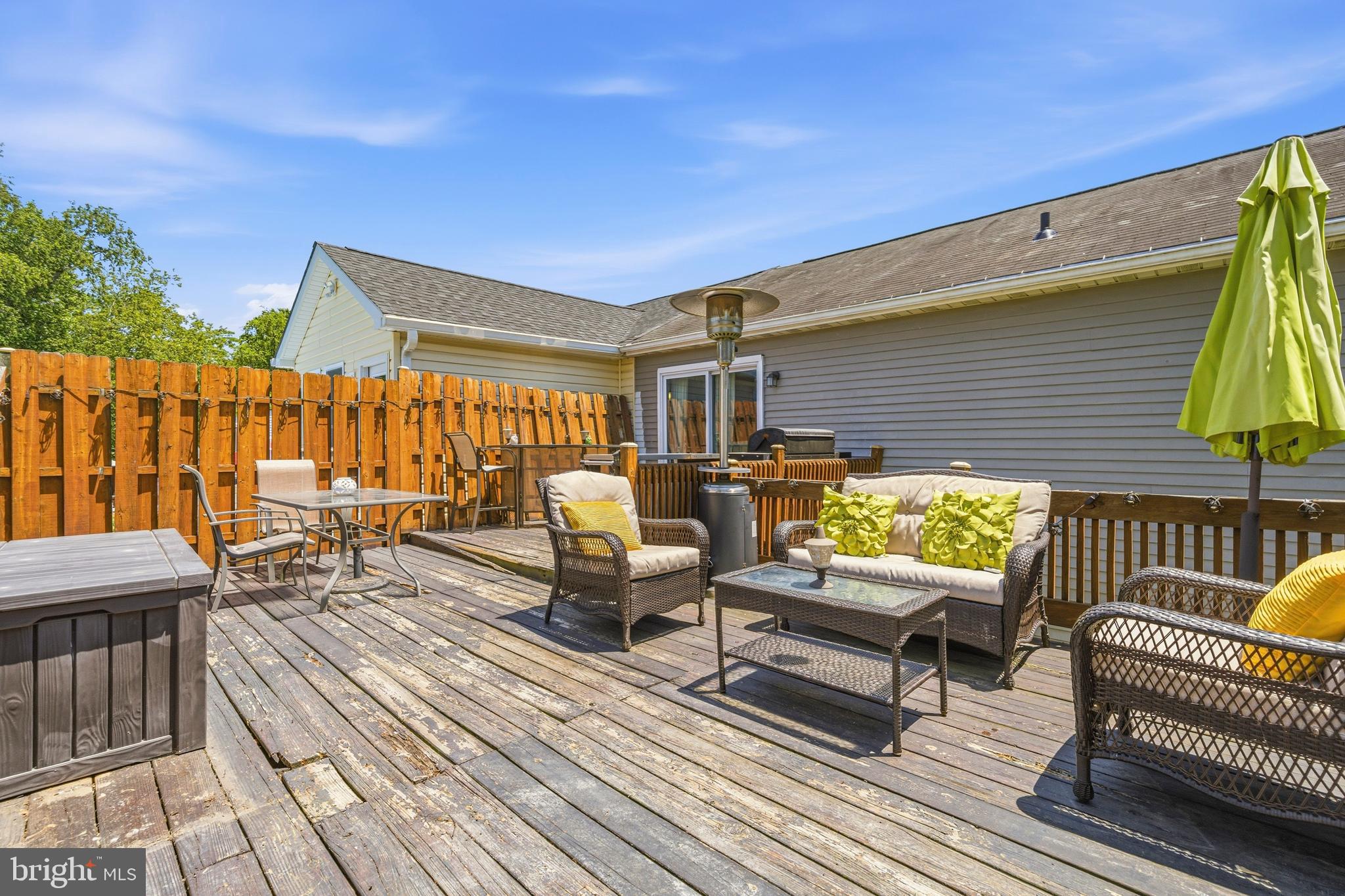 236 Inlet Drive Pasadena, MD 21122 - Photo 10 of 33 a roof deck with a table and chairs