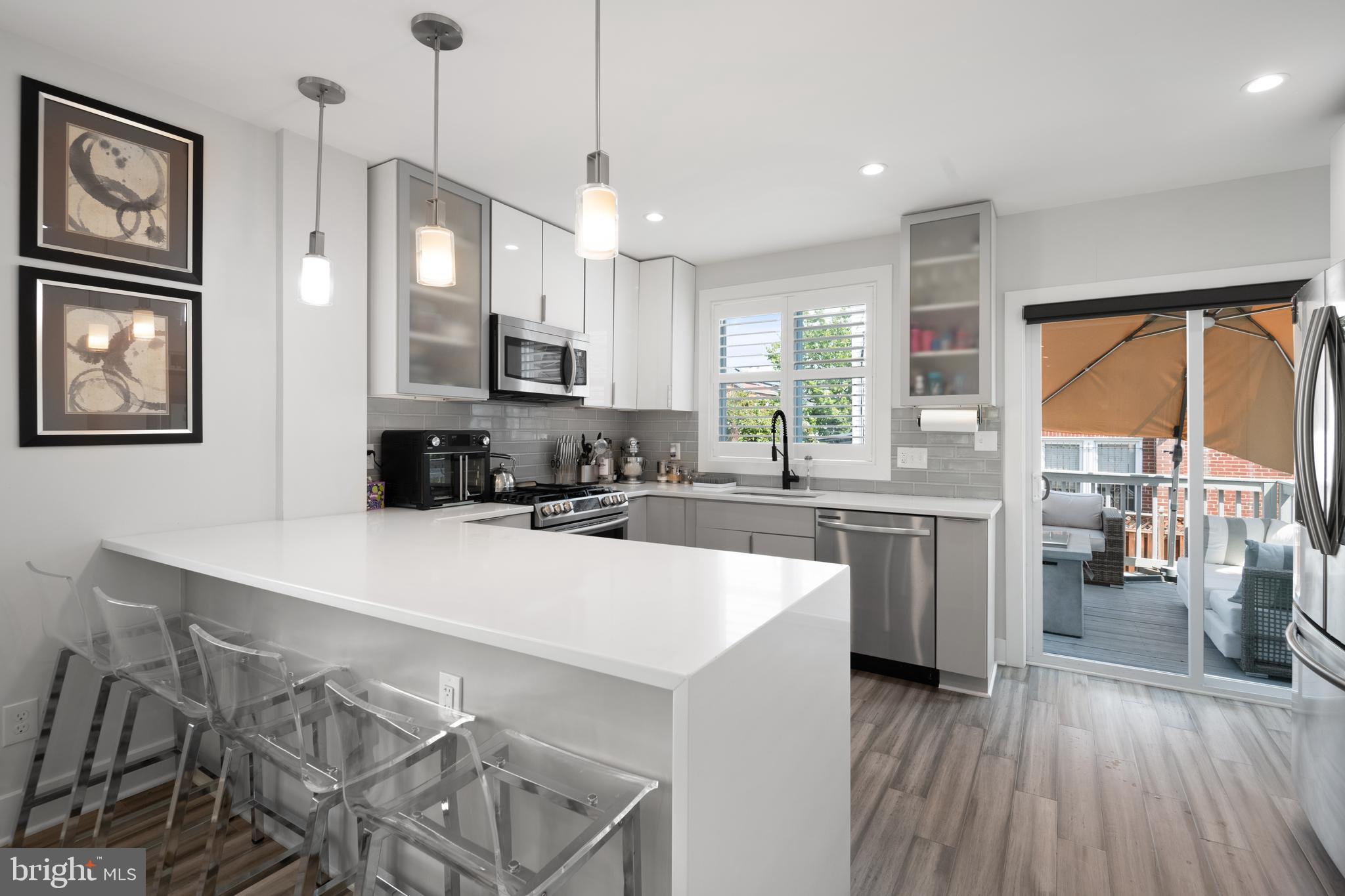 6303 9th Street Northwest Washington, DC 20011 - Photo 11 of 45 a large kitchen with kitchen island a large island in it