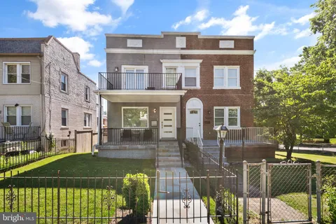 a front view of a building with glass windows and door