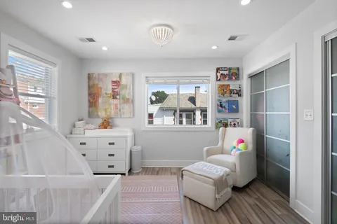 a bedroom with furniture and a window