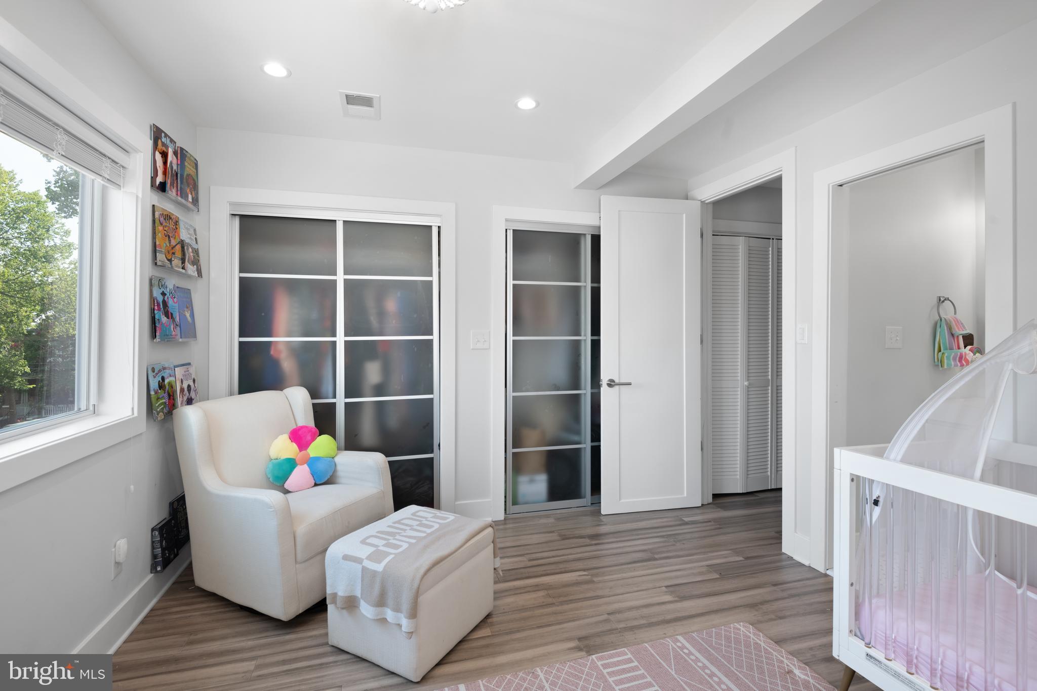 6303 9th Street Northwest Washington, DC 20011 - Photo 26 of 45 a living room with furniture and a potted plant