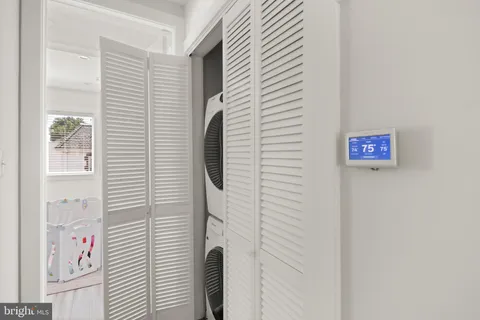 a bathroom with a shower and a window
