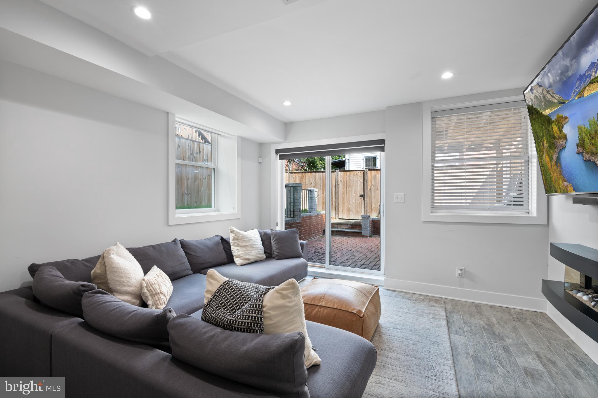 6303 9th Street Northwest Washington, DC 20011 - Photo 35 of 45 a living room with furniture and a window
