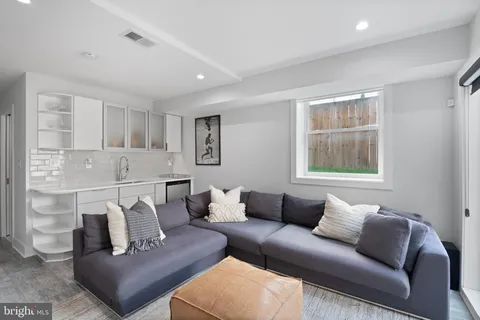 a living room with furniture and a window