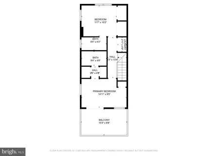 a picture of a bench in front of a wall