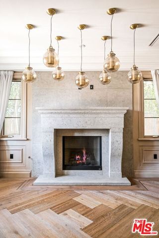 a view of a fireplace with a floor to ceiling window