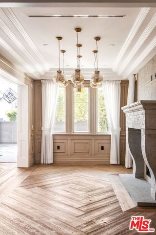 a spacious bedroom with a large bed and a window