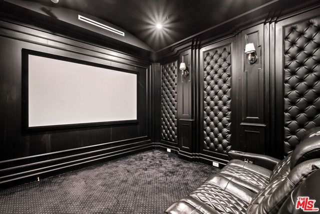 a view of room with projector and windows