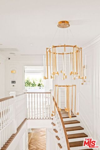 a view of a porch with wooden floor and stairs