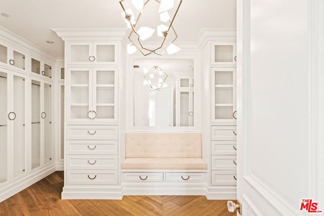 a view of a bedroom with cabinet