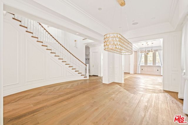 a view of an entryway with wooden floor
