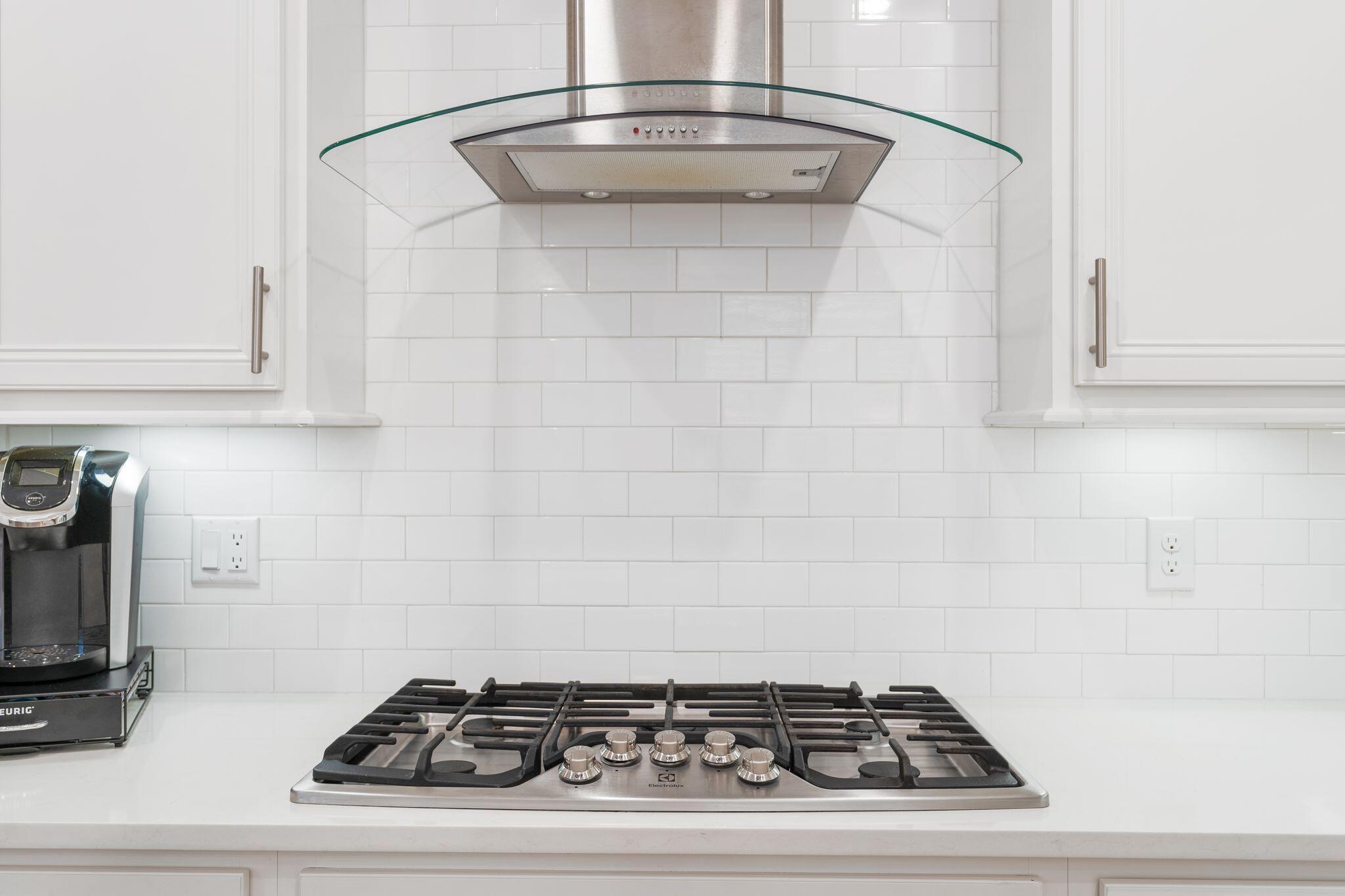 111 Pine Lands Loop East, Unit A Inlet Beach, FL 32461 - Photo 13 of 54 a stove top oven sitting inside of a kitchen