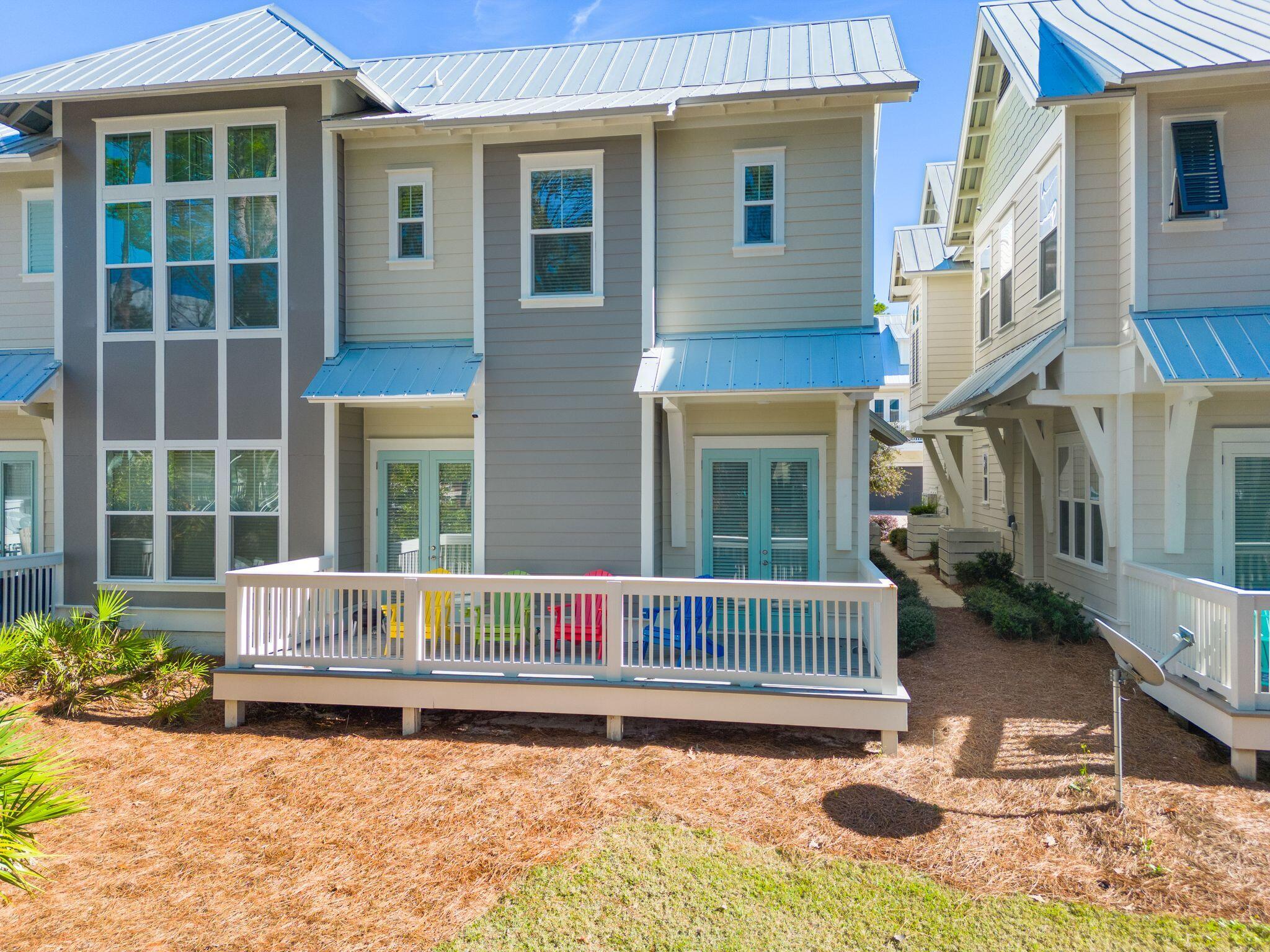 111 Pine Lands Loop East, Unit A Inlet Beach, FL 32461 - Photo 19 of 54 a house with a sitting space and garden space