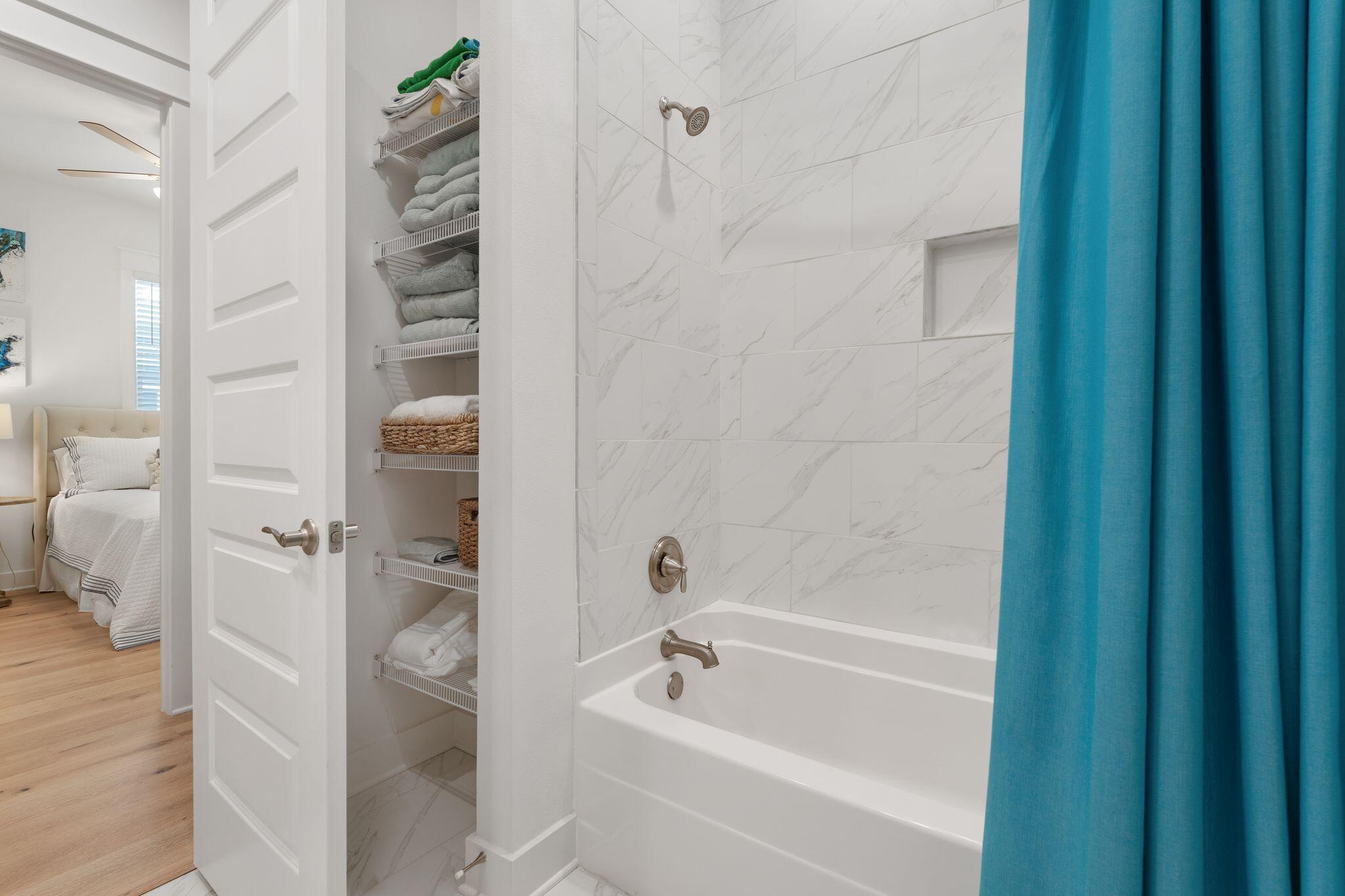 111 Pine Lands Loop East, Unit A Inlet Beach, FL 32461 - Photo 23 of 54 a bathroom with a bathtub and shower