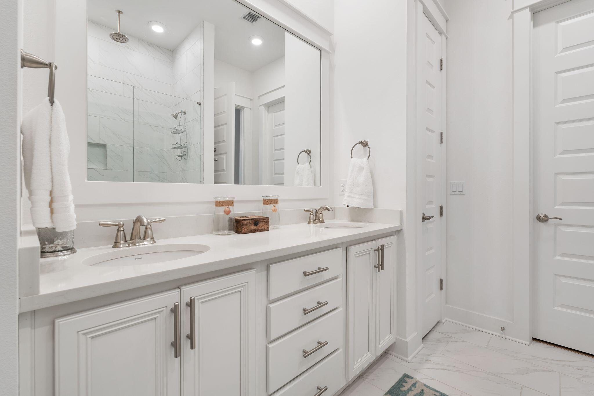 111 Pine Lands Loop East, Unit A Inlet Beach, FL 32461 - Photo 30 of 54 a bathroom with double sink and a mirror