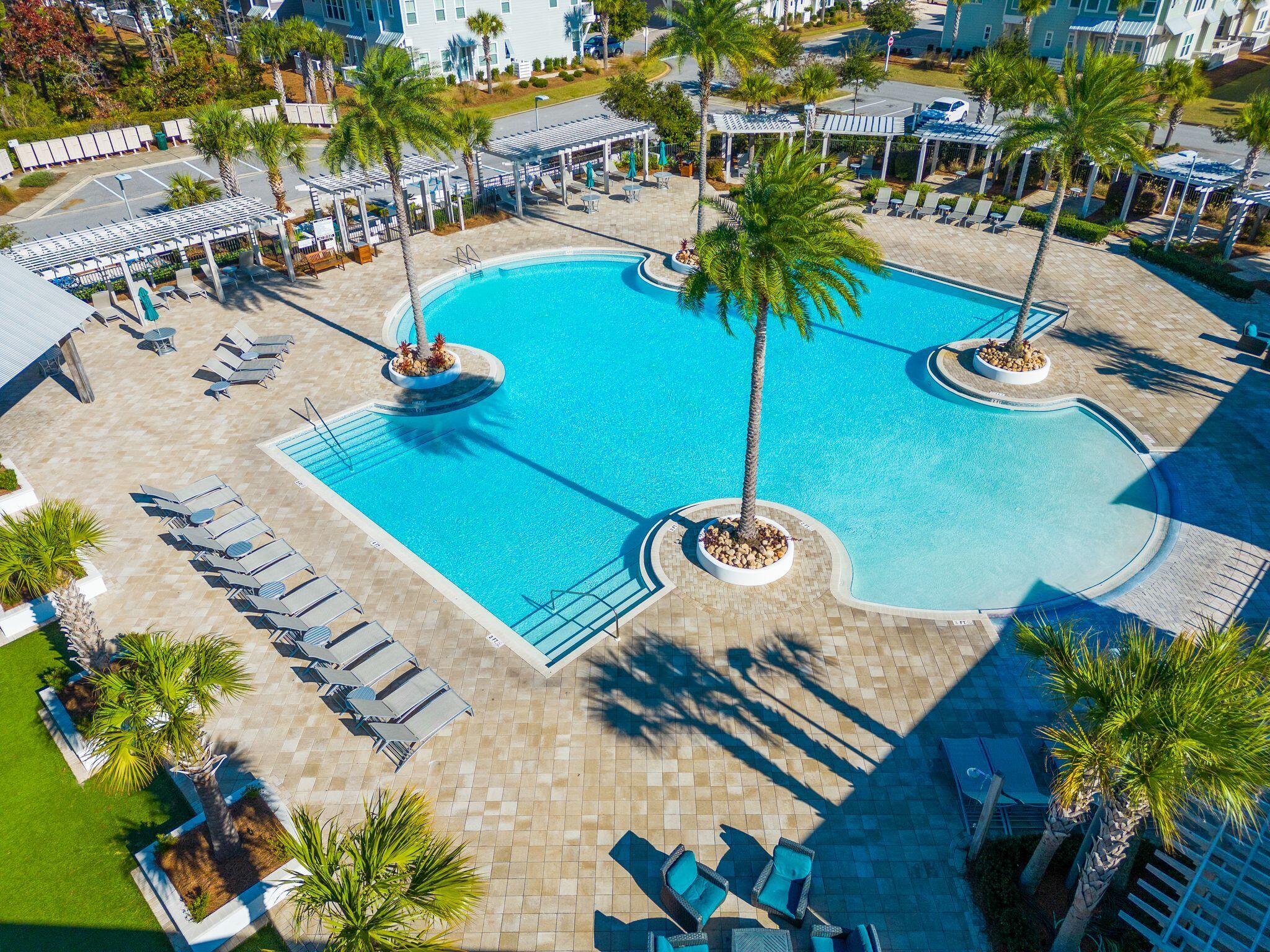 111 Pine Lands Loop East, Unit A Inlet Beach, FL 32461 - Photo 50 of 54 a view of a swimming pool with lounge chair