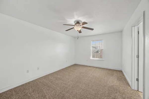 a spacious bathroom with a granite countertop sink a mirror and a