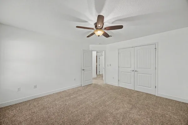 a bathroom with a glass shower door