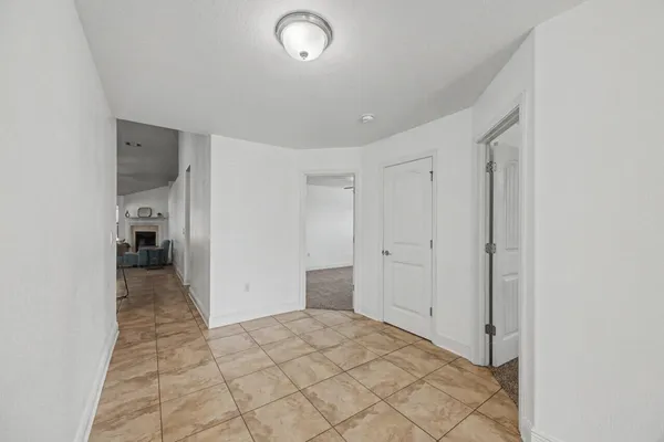 a view of a big room with closet and windows