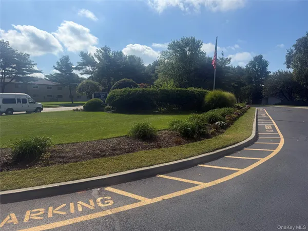 a sign board with a small yard