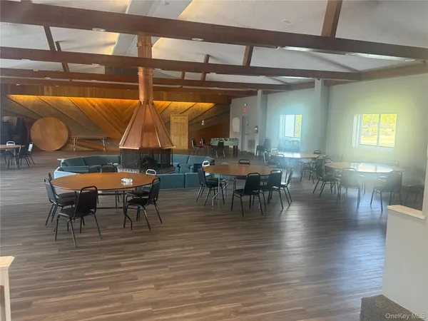 a view of a porch with furniture and a yard