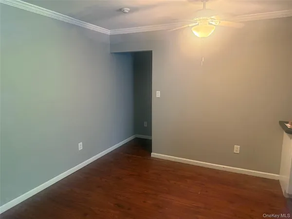 a kitchen with a sink cabinets and a window