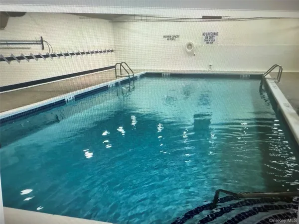 a view of a livingroom with gym equipment