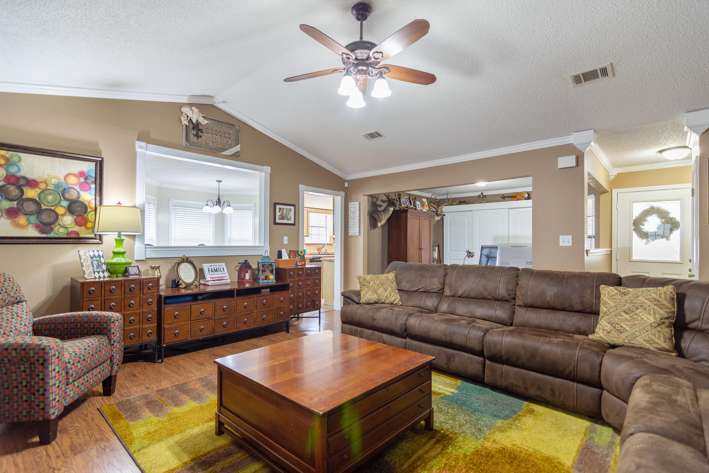5551 Buckward Road Baker, FL 32531 - Photo 13 of 47 a living room with furniture and a view of kitchen