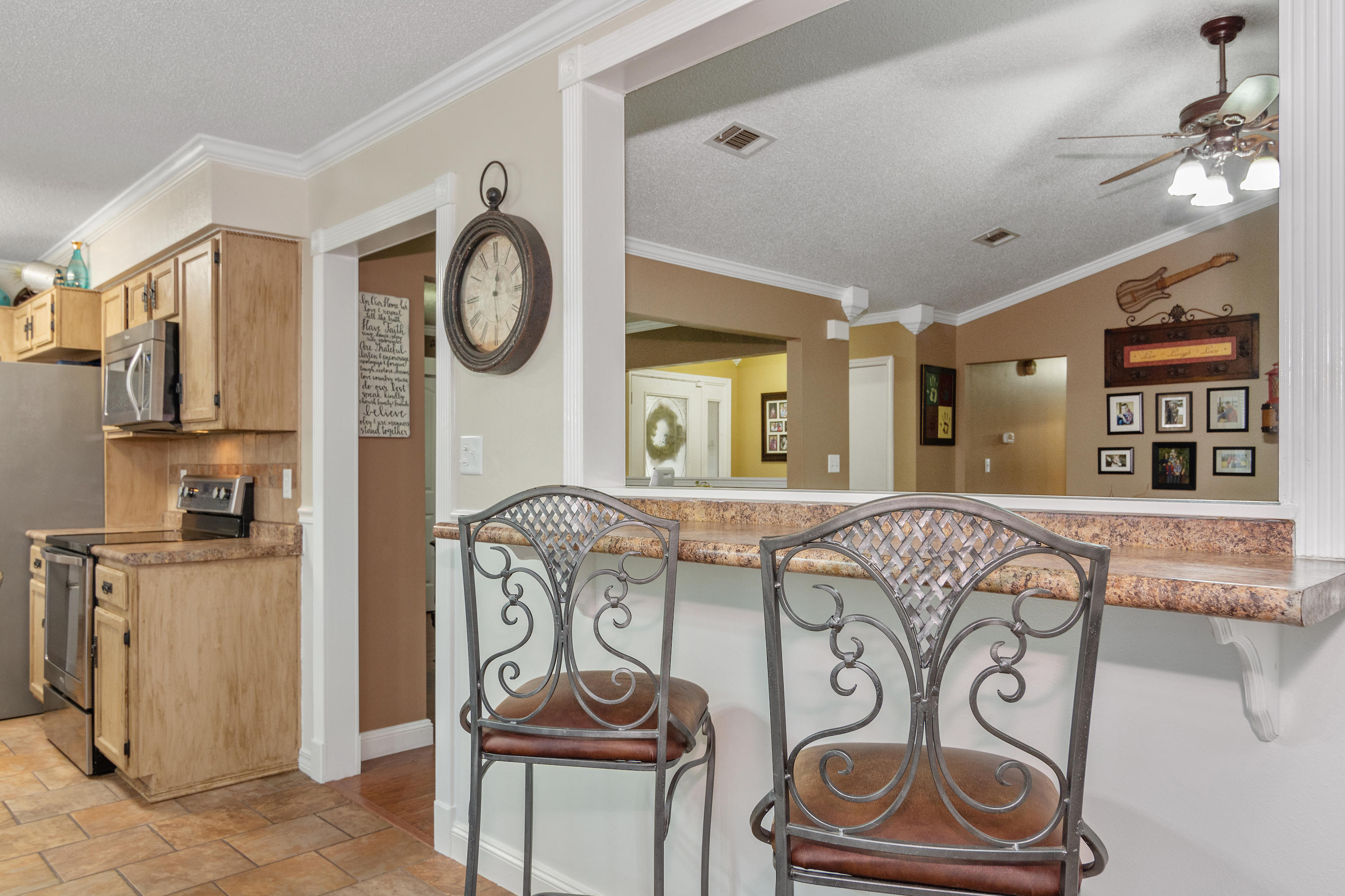 5551 Buckward Road Baker, FL 32531 - Photo 18 of 47 a view of entryway with furniture and wooden floor