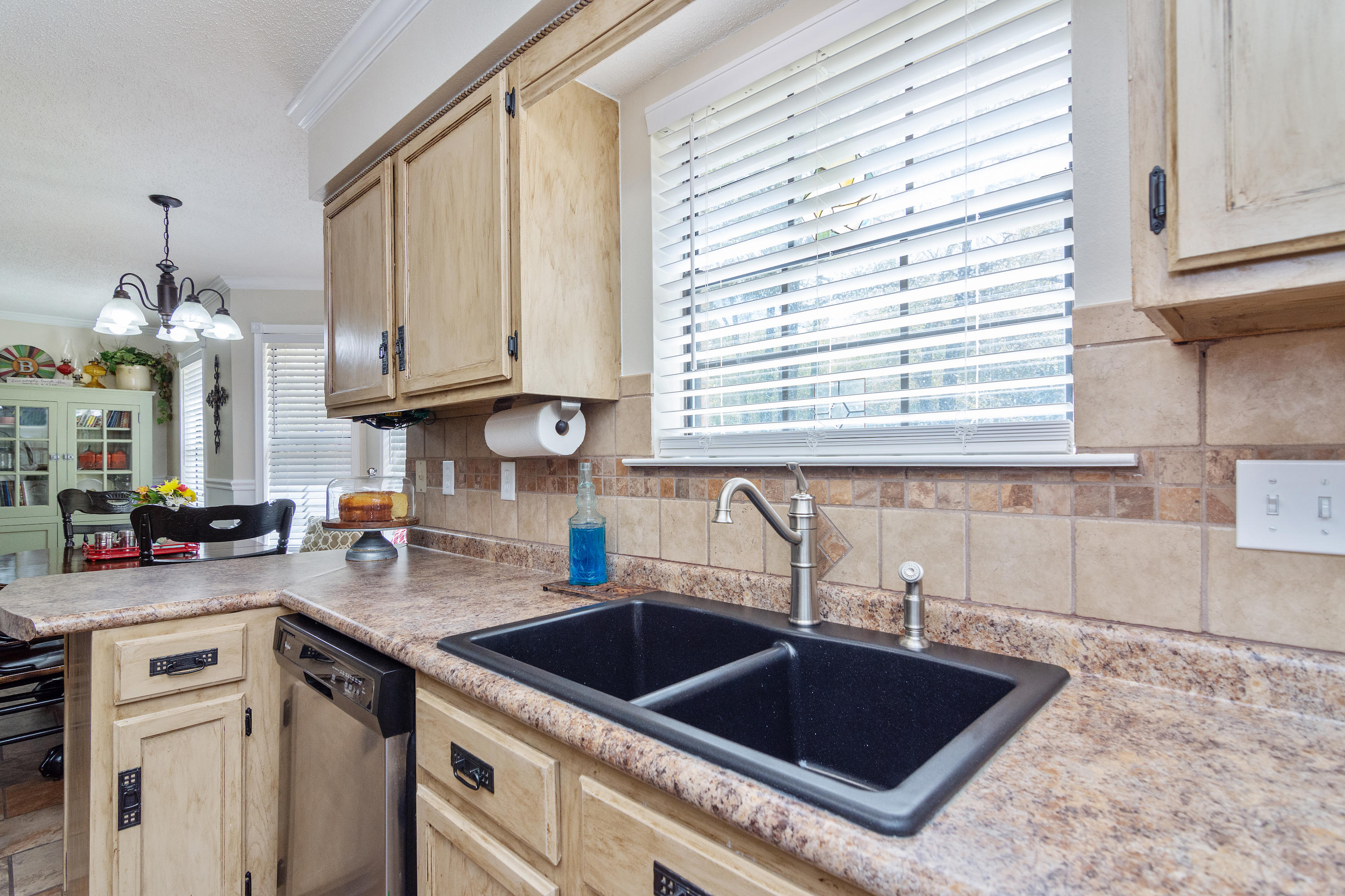 5551 Buckward Road Baker, FL 32531 - Photo 23 of 47 a kitchen with a sink cabinets and window