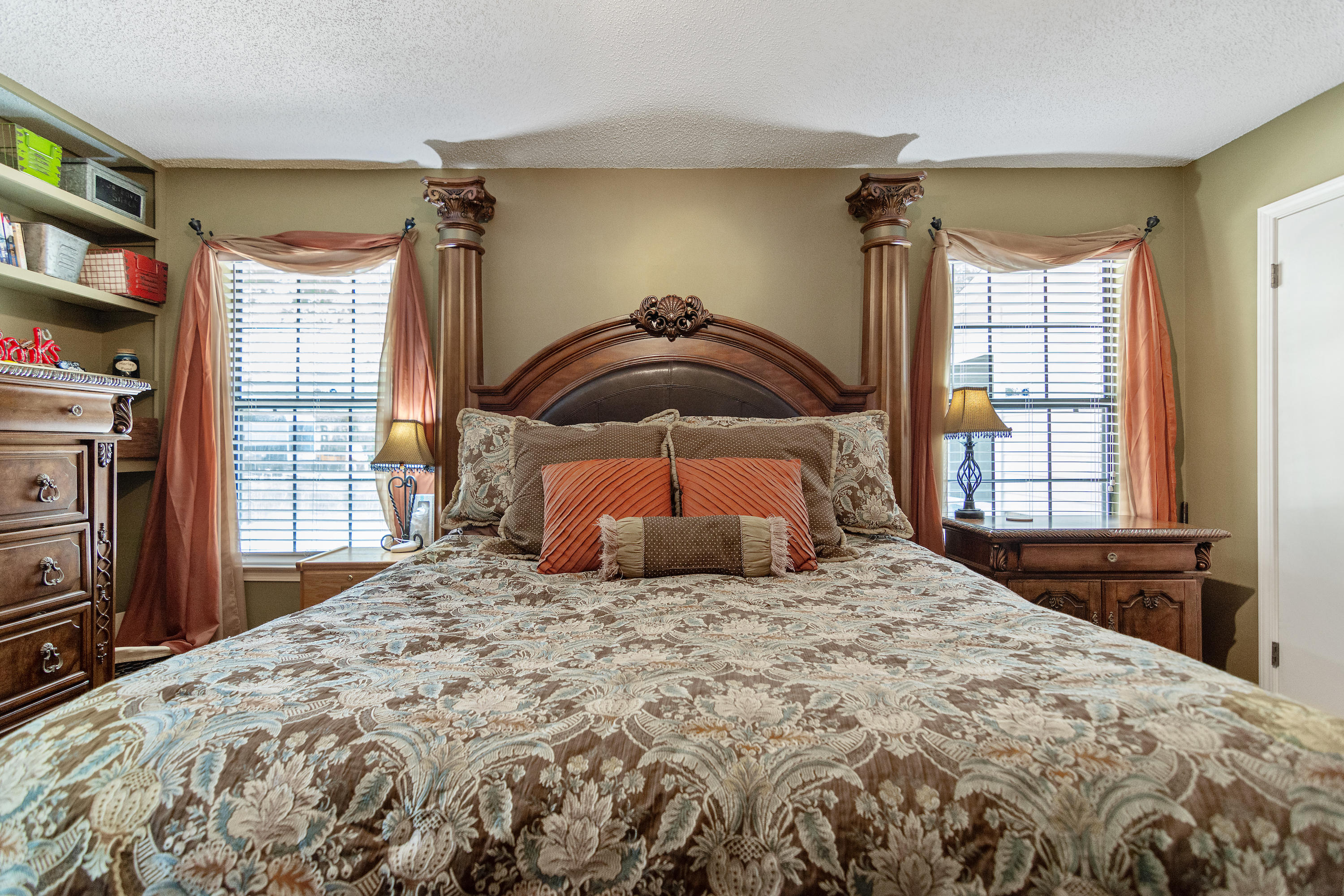 5551 Buckward Road Baker, FL 32531 - Photo 27 of 47 a bedroom with a bed and a flat tv screen on dresser