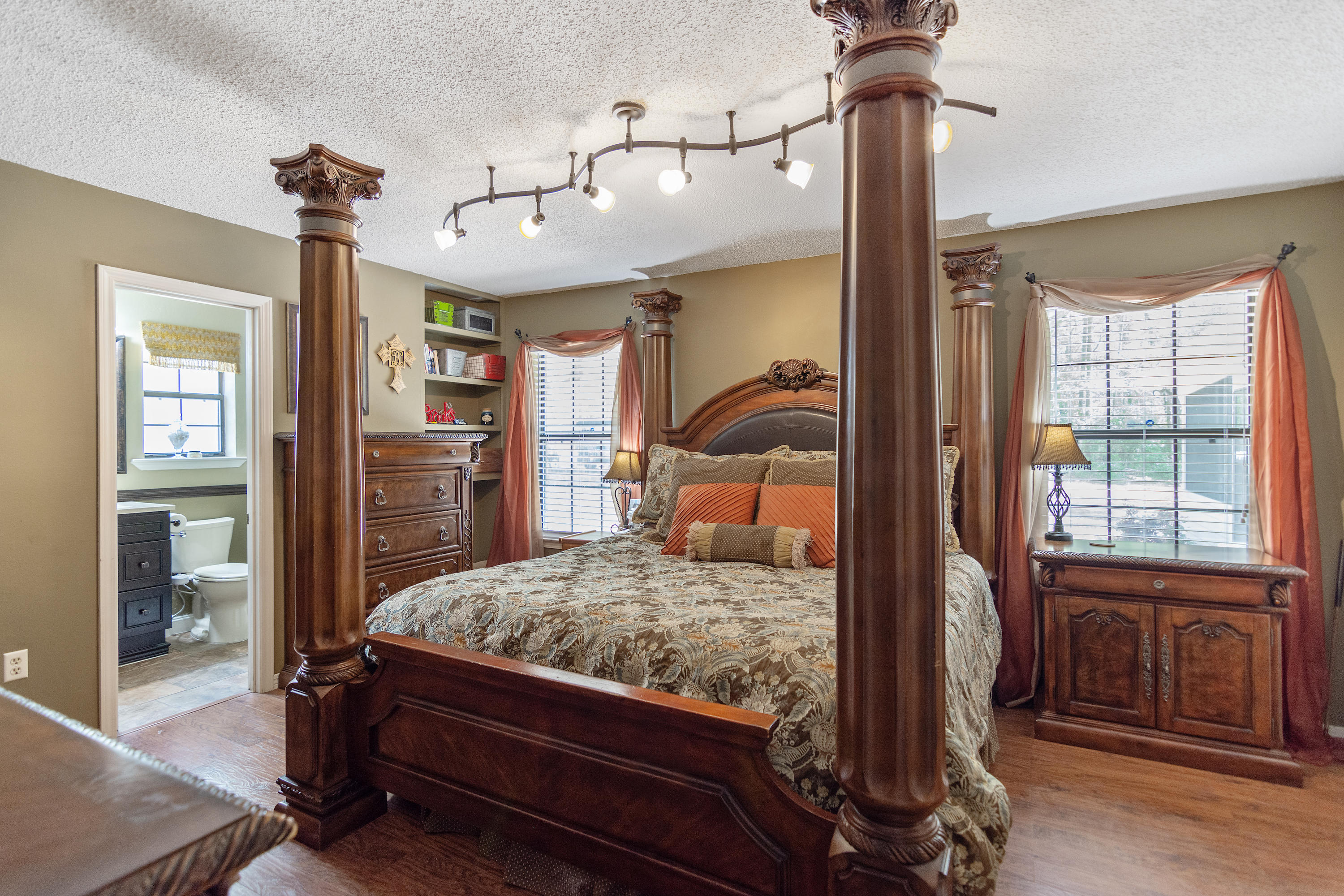 5551 Buckward Road Baker, FL 32531 - Photo 28 of 47 a bedroom with a bed and wooden floor