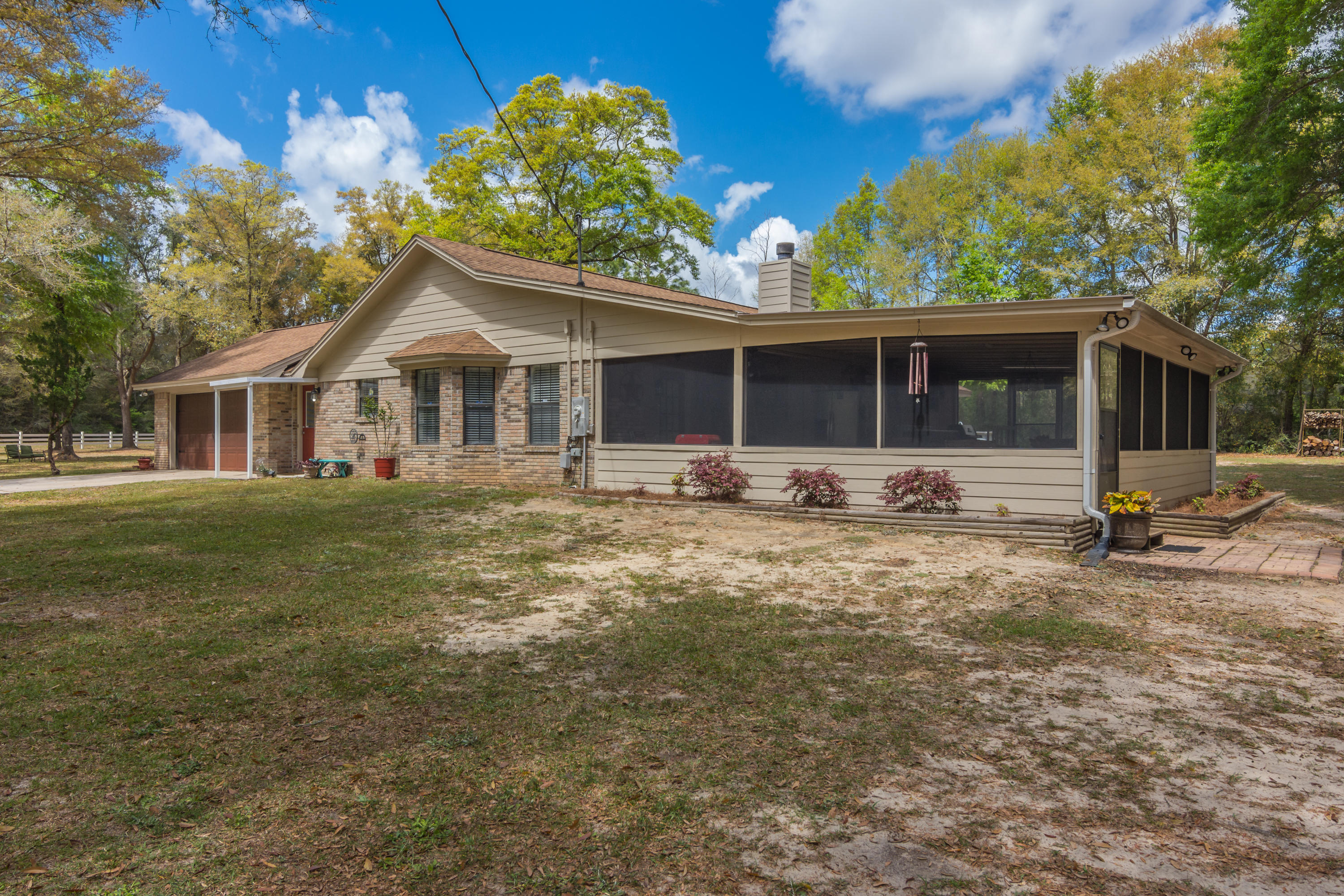5551 Buckward Road Baker, FL 32531 - Photo 4 of 47 a front view of a house with a yard