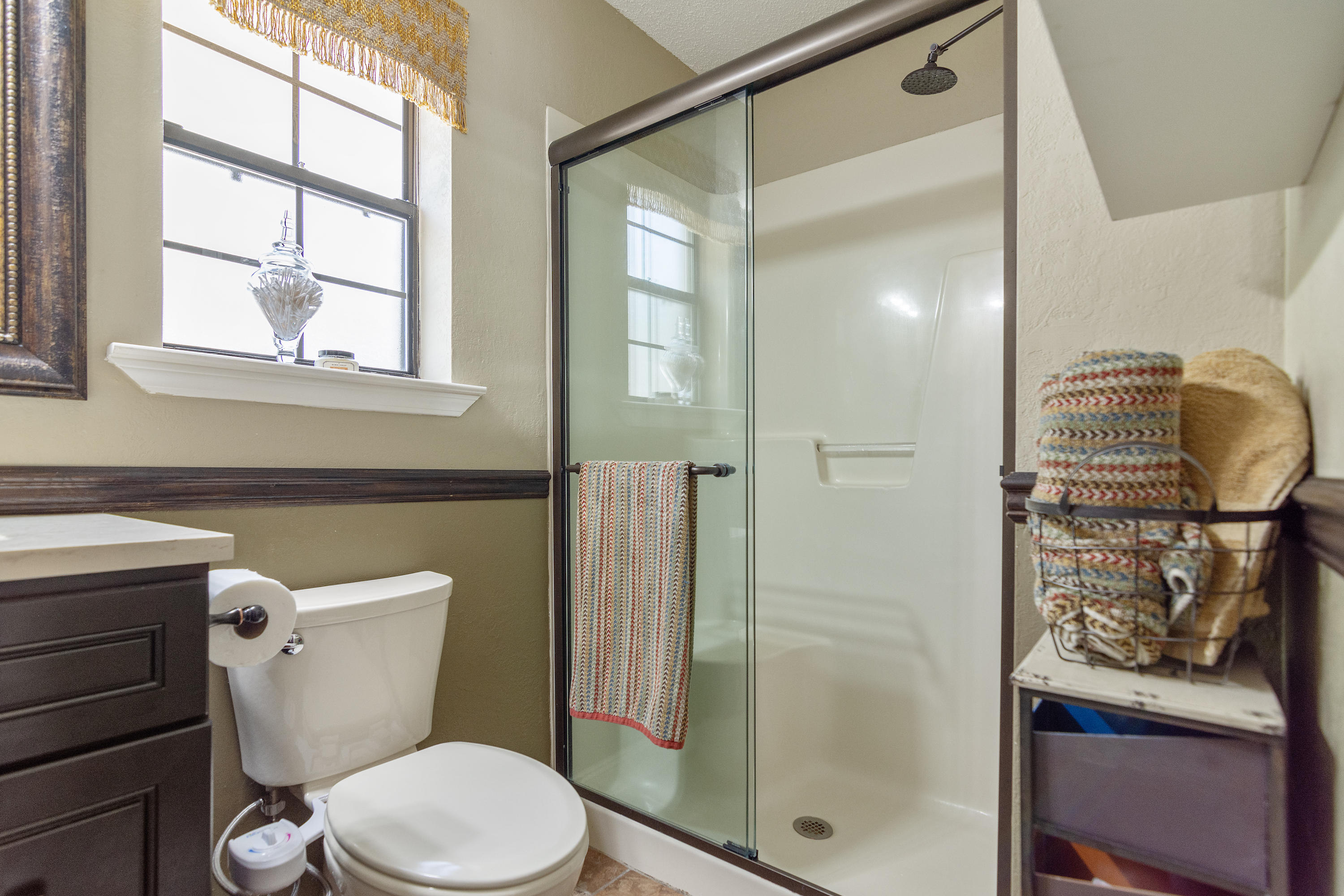 5551 Buckward Road Baker, FL 32531 - Photo 37 of 47 a bathroom with a toilet a sink and shower