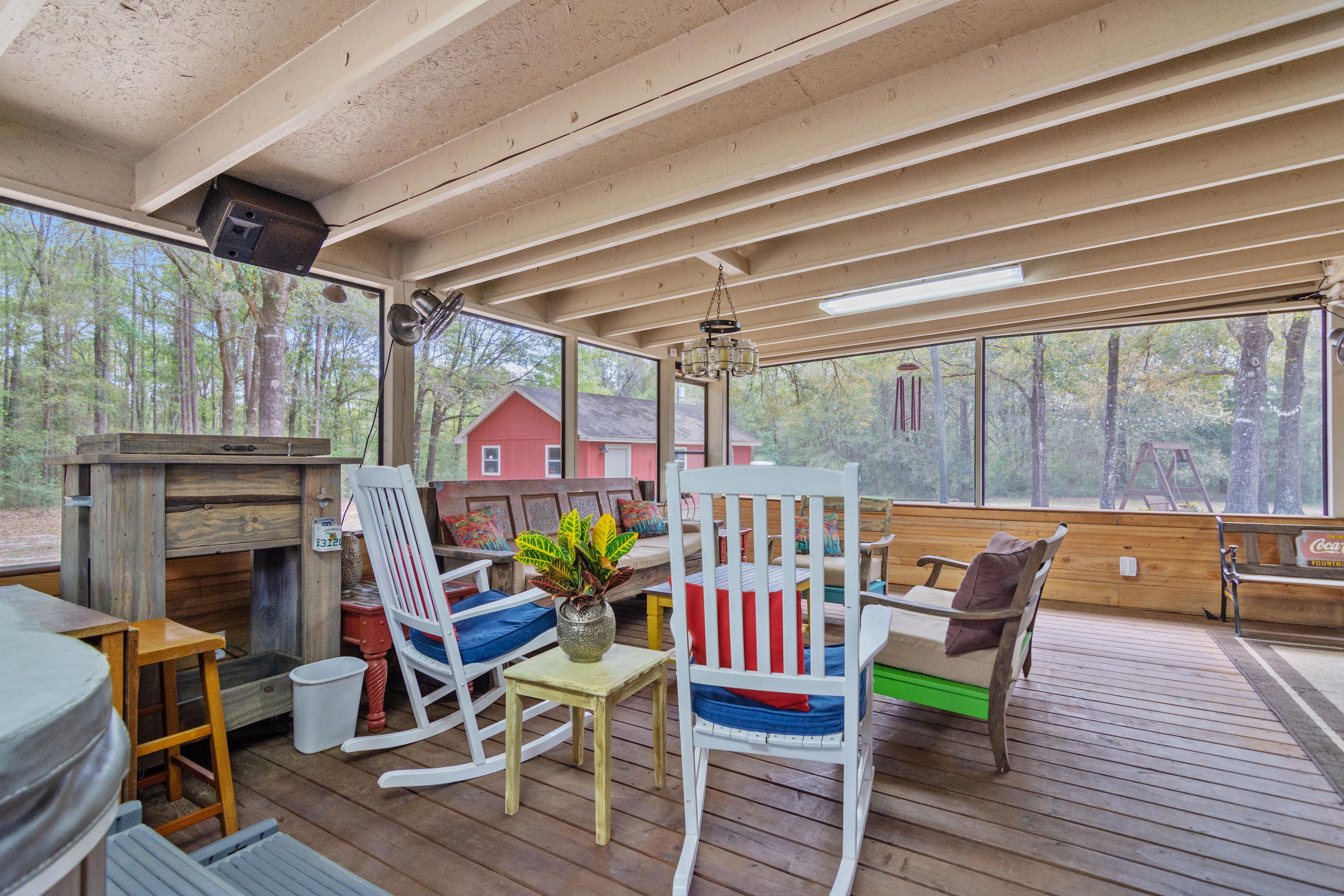 5551 Buckward Road Baker, FL 32531 - Photo 42 of 47 a outdoor dining space with furniture and wooden floor