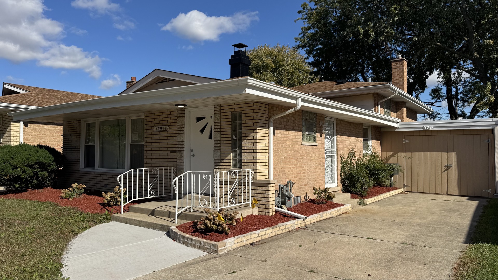 a view of house with a patio
