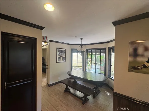 a living room with furniture window and a flat screen tv