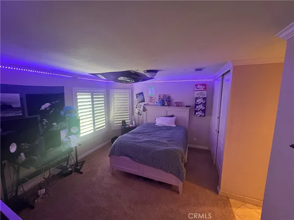 a bed room with a bed and a window