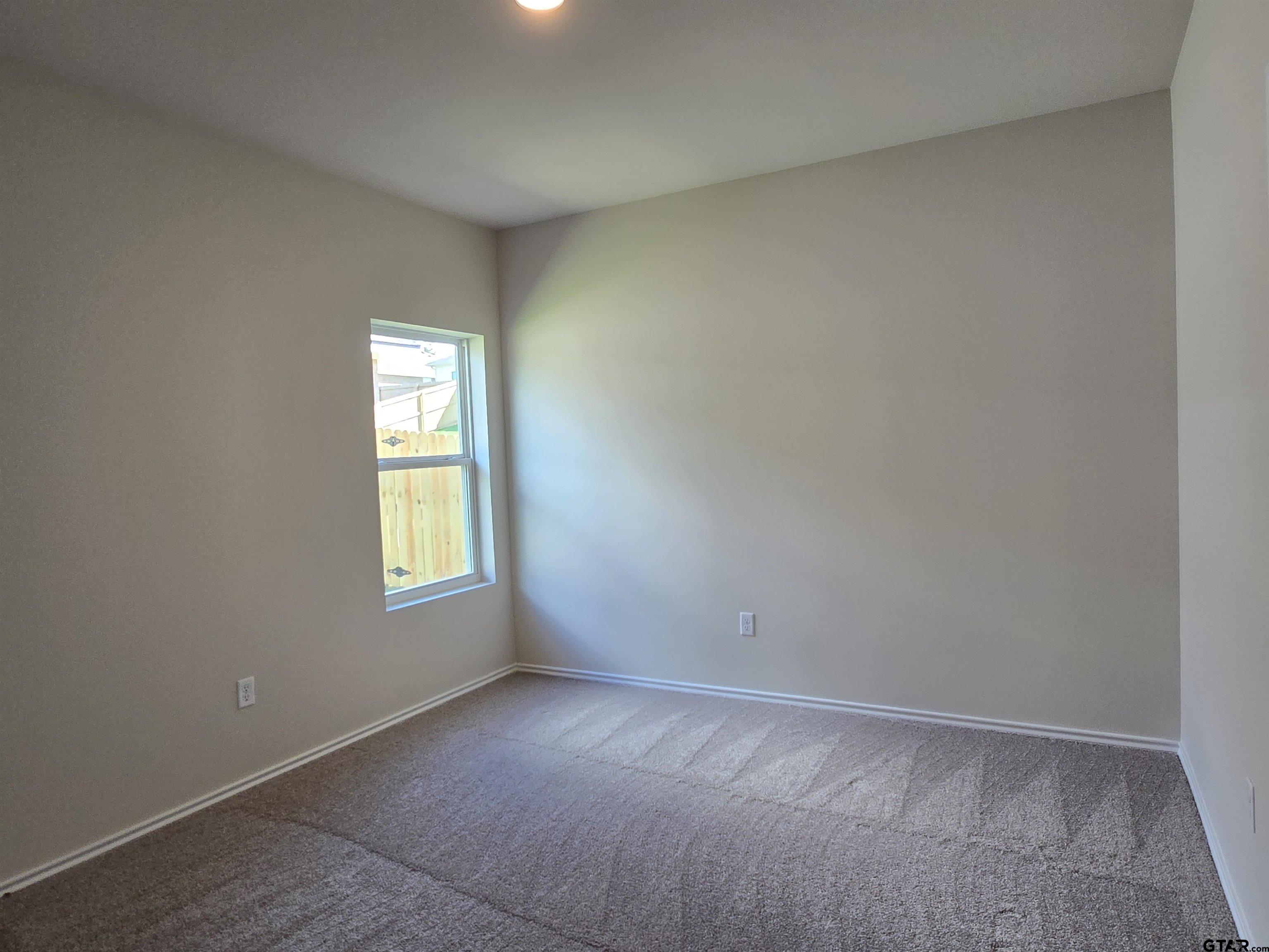 324 Erica Way Lindale, TX 75771 - Photo 1 of 14 an empty room with a window