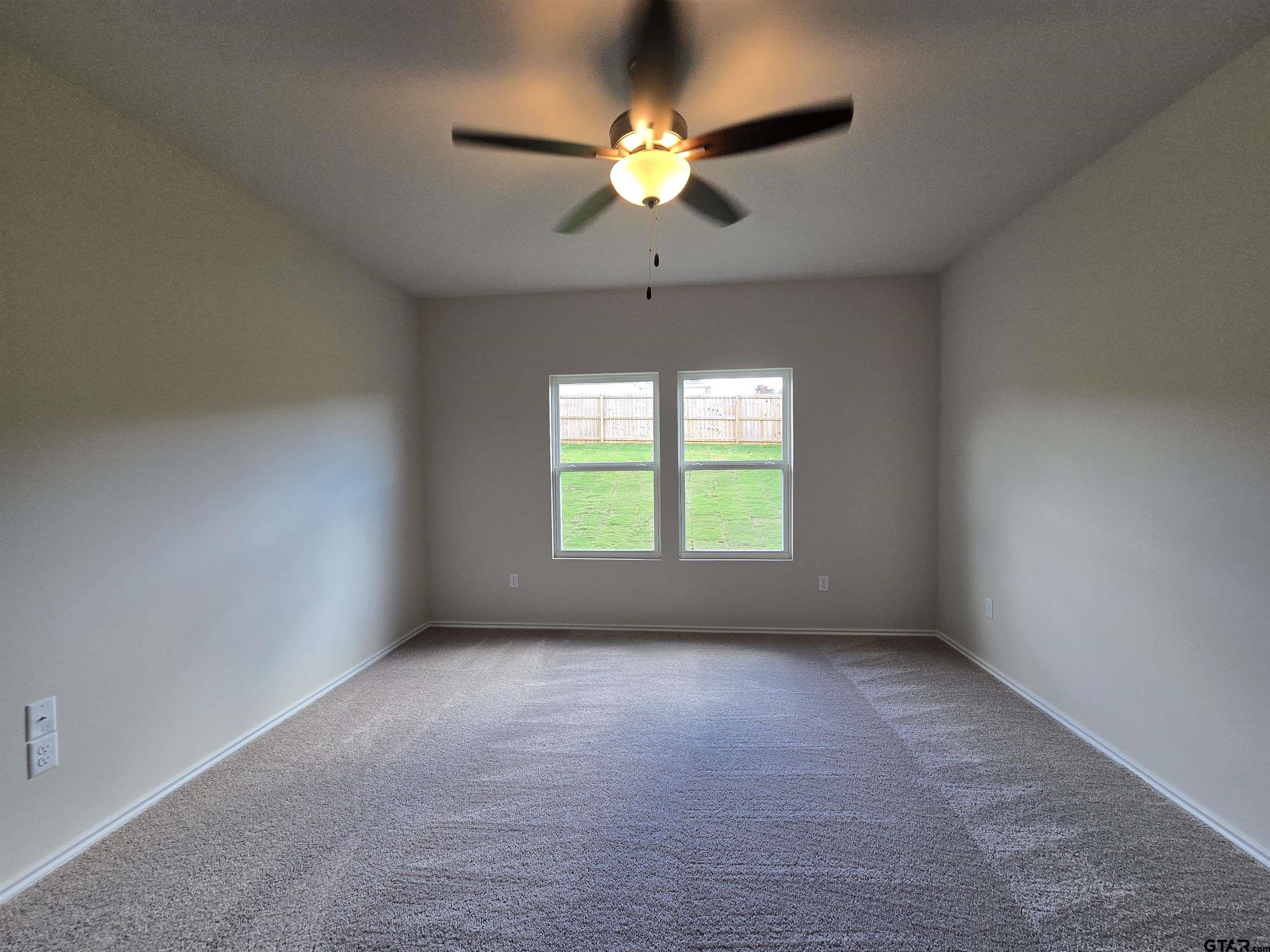 324 Erica Way Lindale, TX 75771 - Photo 12 of 14 a view of an empty room with a window
