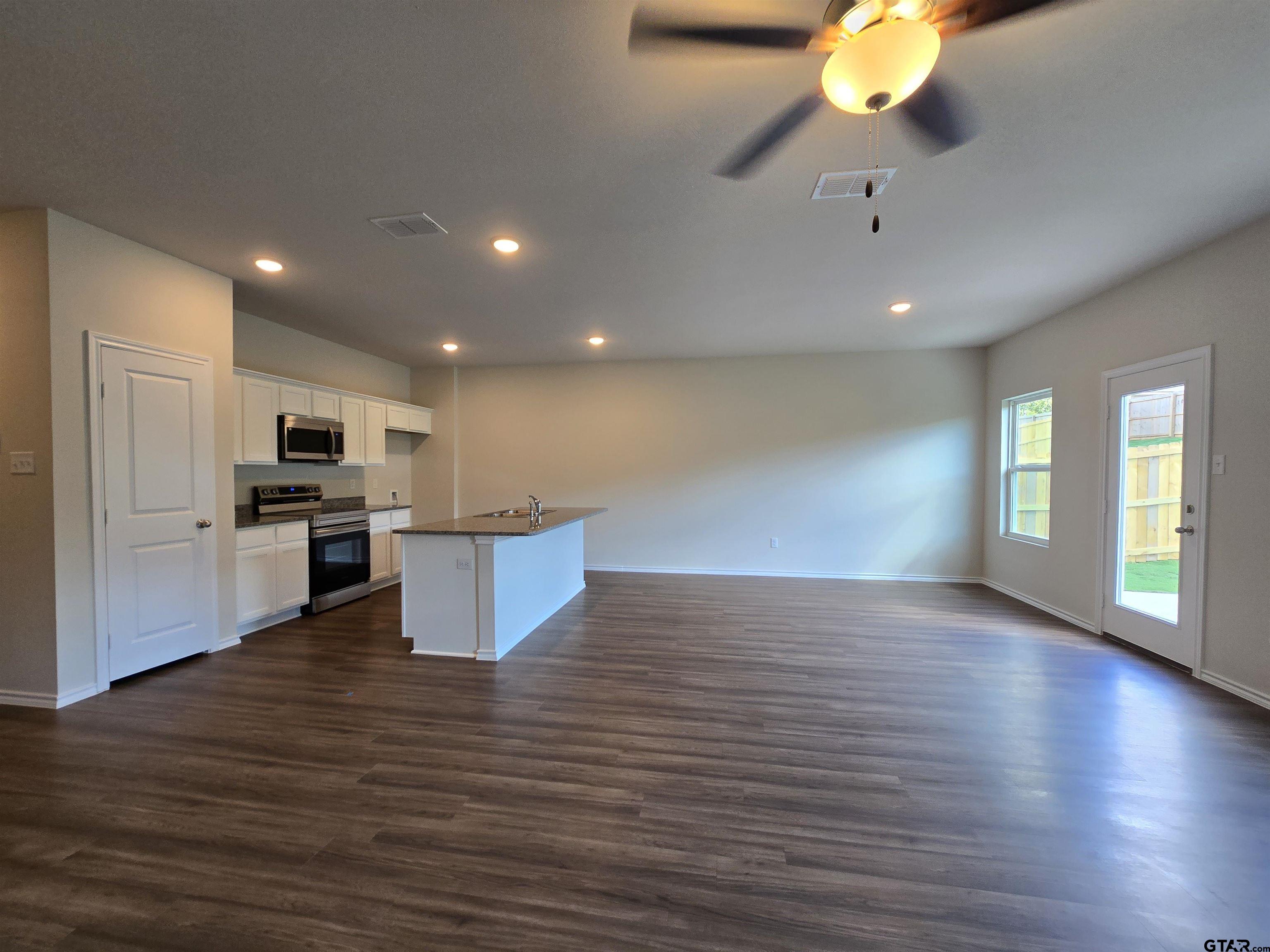 324 Erica Way Lindale, TX 75771 - Photo 4 of 14 a view of kitchen with cabinets and wooden floor
