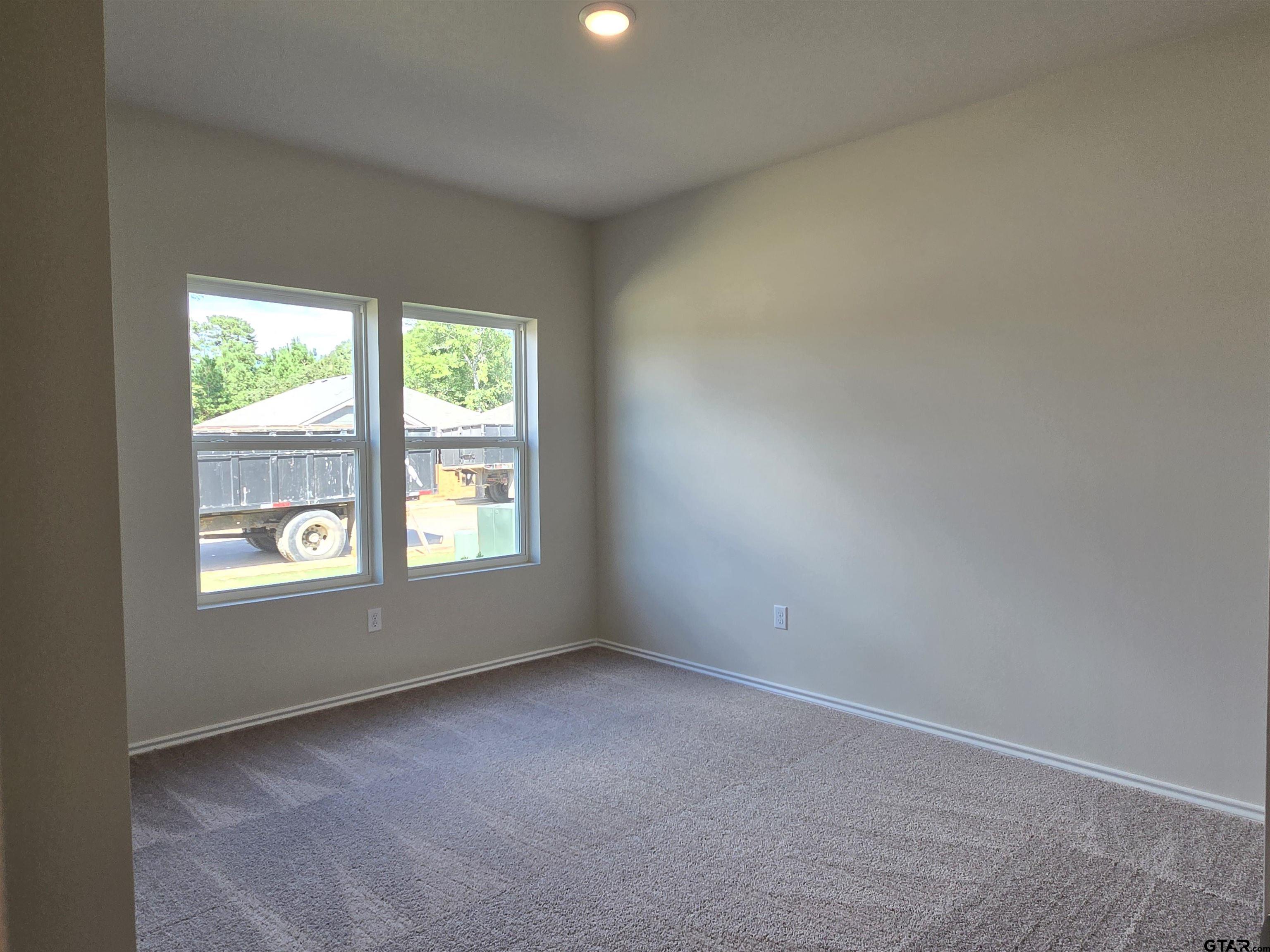 324 Erica Way Lindale, TX 75771 - Photo 8 of 14 an empty room with a window
