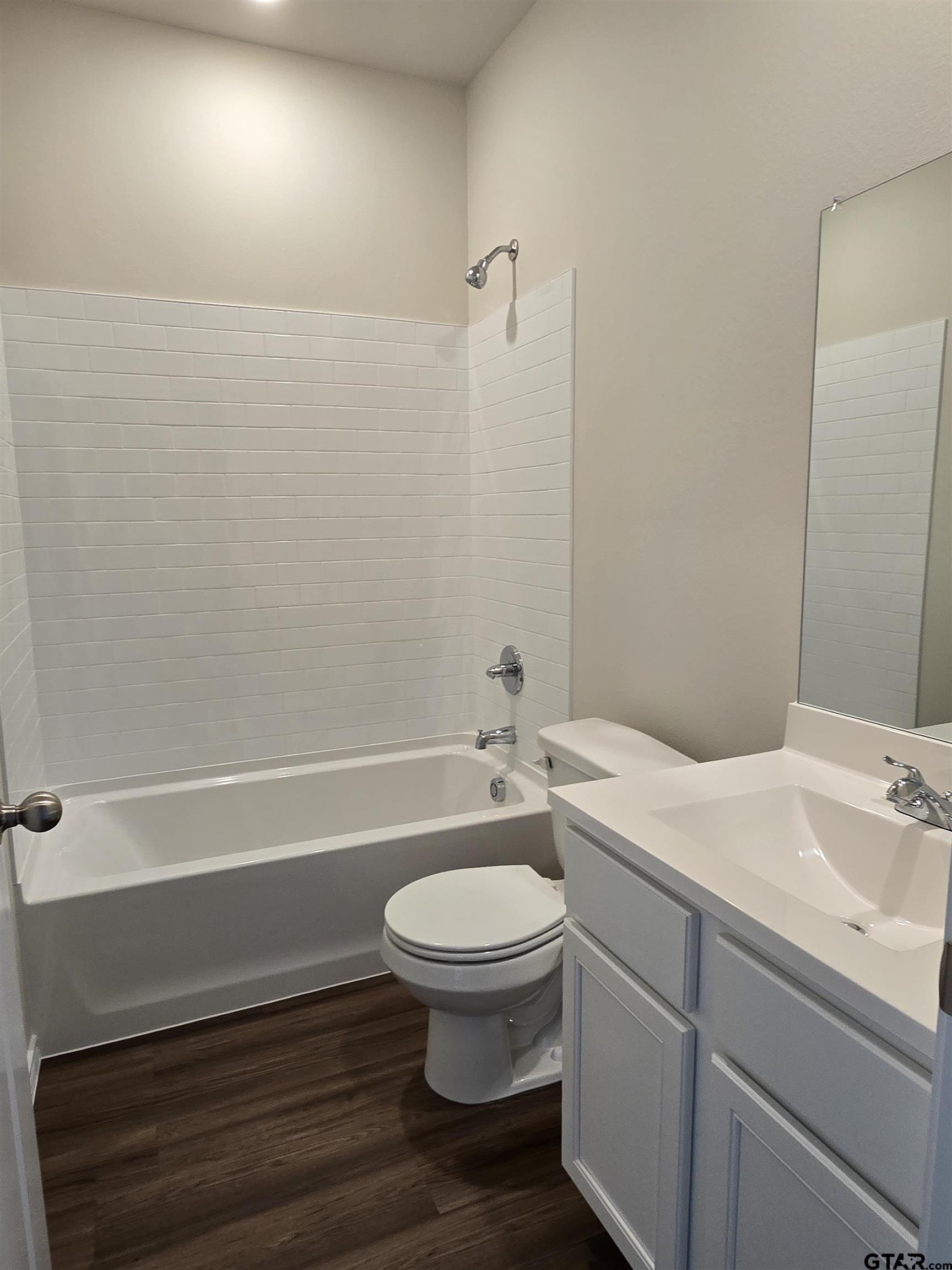 324 Erica Way Lindale, TX 75771 - Photo 10 of 14 a bathroom with a sink a toilet and shower