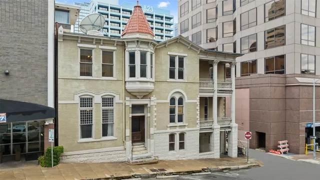 a front view of a building with a street