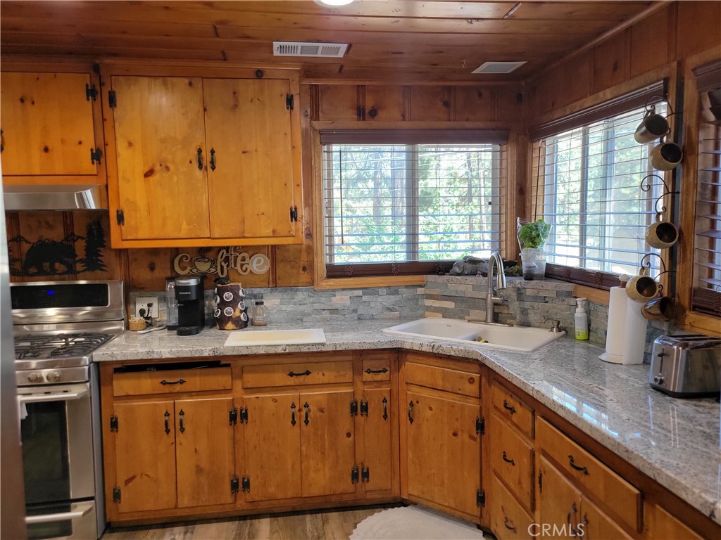 1116 Lark Road Wrightwood, CA 92397 - Photo 14 of 46 a kitchen with sink cabinets and window